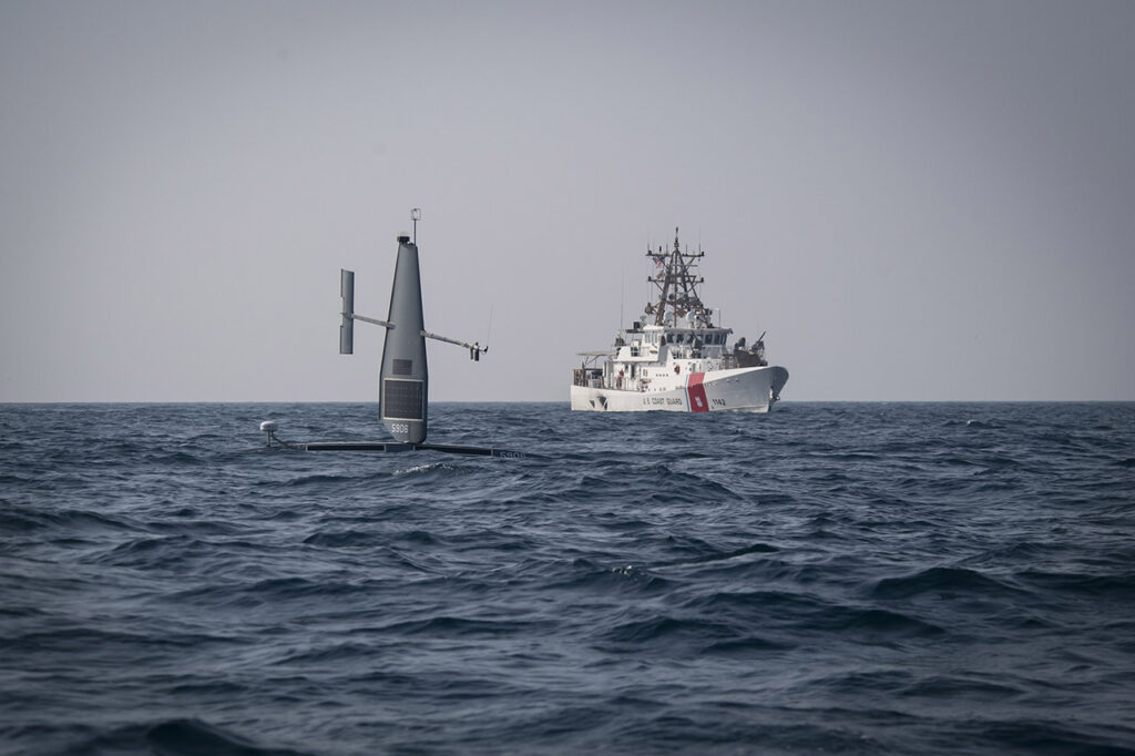 A Saildrone Explorer unmanned surface vessel (USV) operates with fast response cutter USCGC Robert Goldman (WPC 1142) in the Arabian Gulf during exercise Phantom Scope, Oct. 7. During the bilateral exercise between the United States and United Kingdom, USVs operated in conjunction with crewed ships and naval command centers ashore in Bahrain. (U.S. Navy photo by Chief Mass Communication Specialist Roland Franklin)