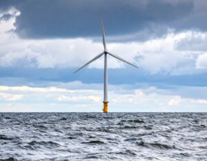 A wind turbine at sea (AI generated with Adobe Firefly)